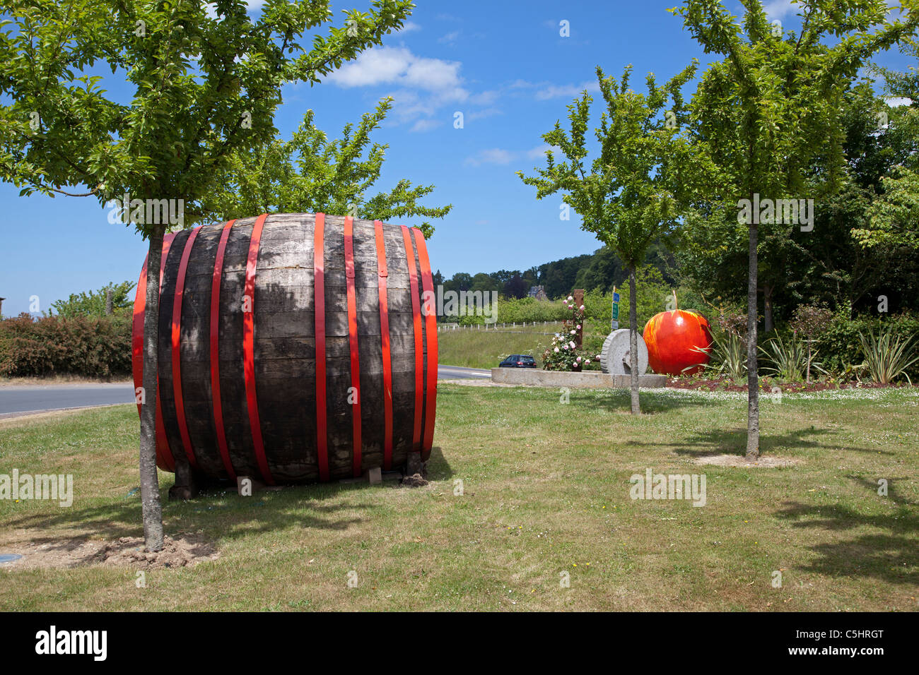 Cider barrel and apple on a traffic island near Nimoutiers in the Orne