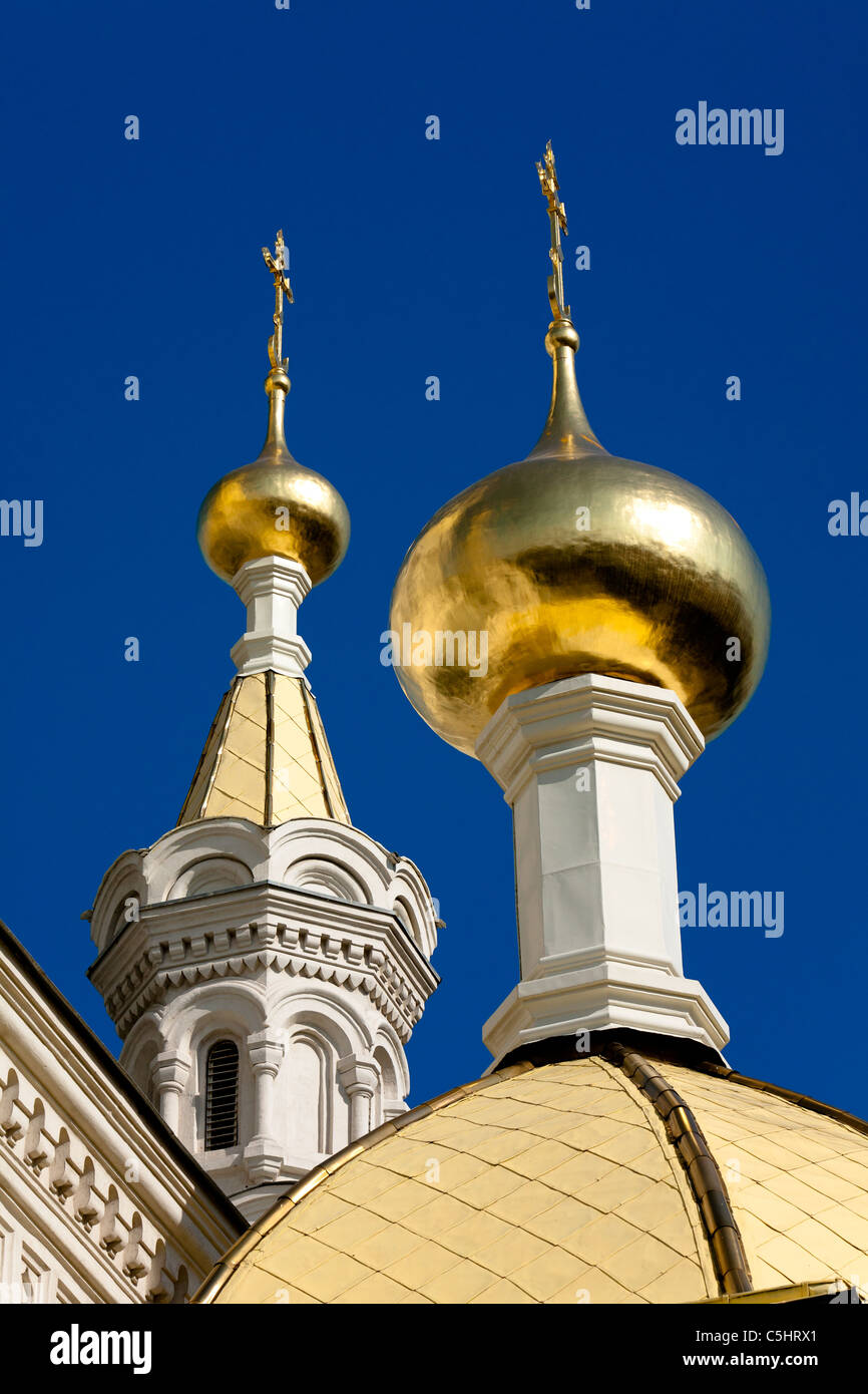 Golden onion domes on a church in Sevastopol. Blue sky Stock Photo