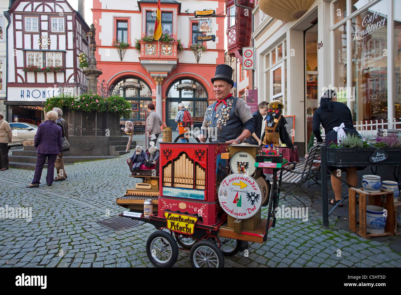 Hurdy-gurdy player, barrel organ, street musican, market square, market place, old town, Bernkastel-Kues, Mosel river, Rhineland-Palatinate, Germany Stock Photo
