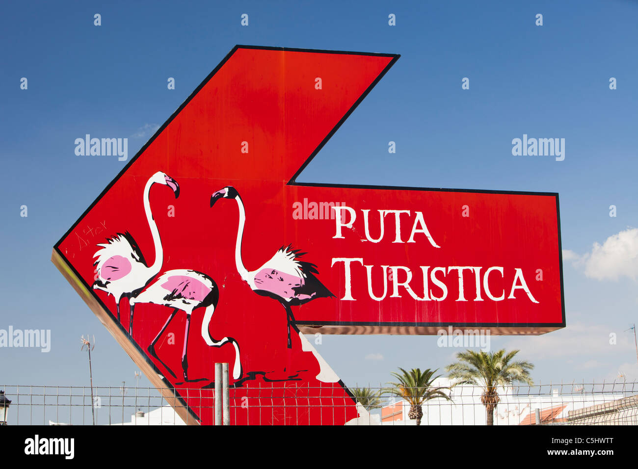 An arrow painted with Flamingoe's, to show the areas importance to wildlife in Isla Major, a town in the Coto Donana, Spain Stock Photo