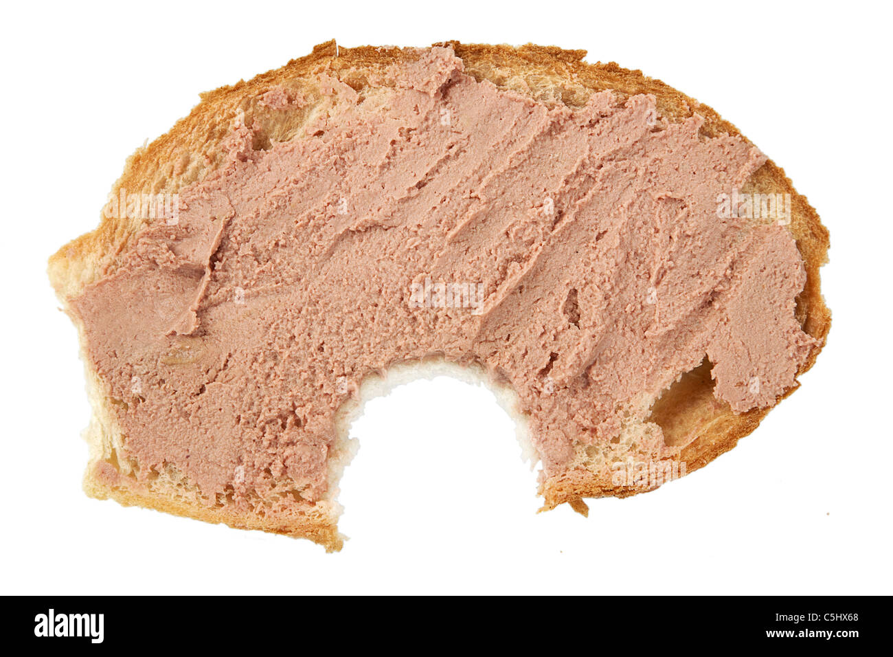 bitten slice of bread with pate on white background Stock Photo