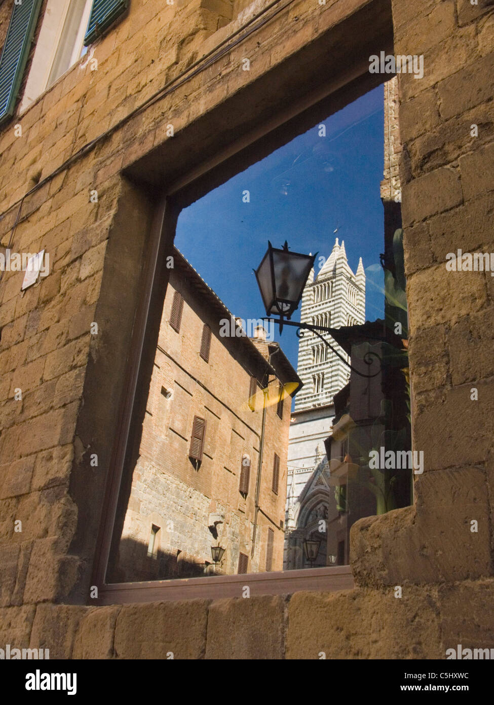 City sites reflected in windows in the the famed city of Siena, Italy. Stock Photo