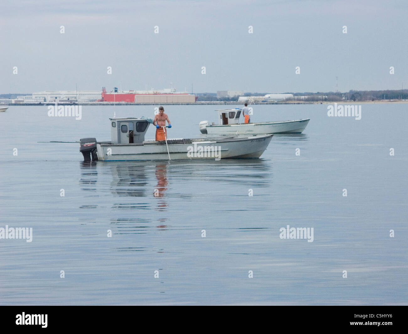 Raking clams hi-res stock photography and images - Alamy