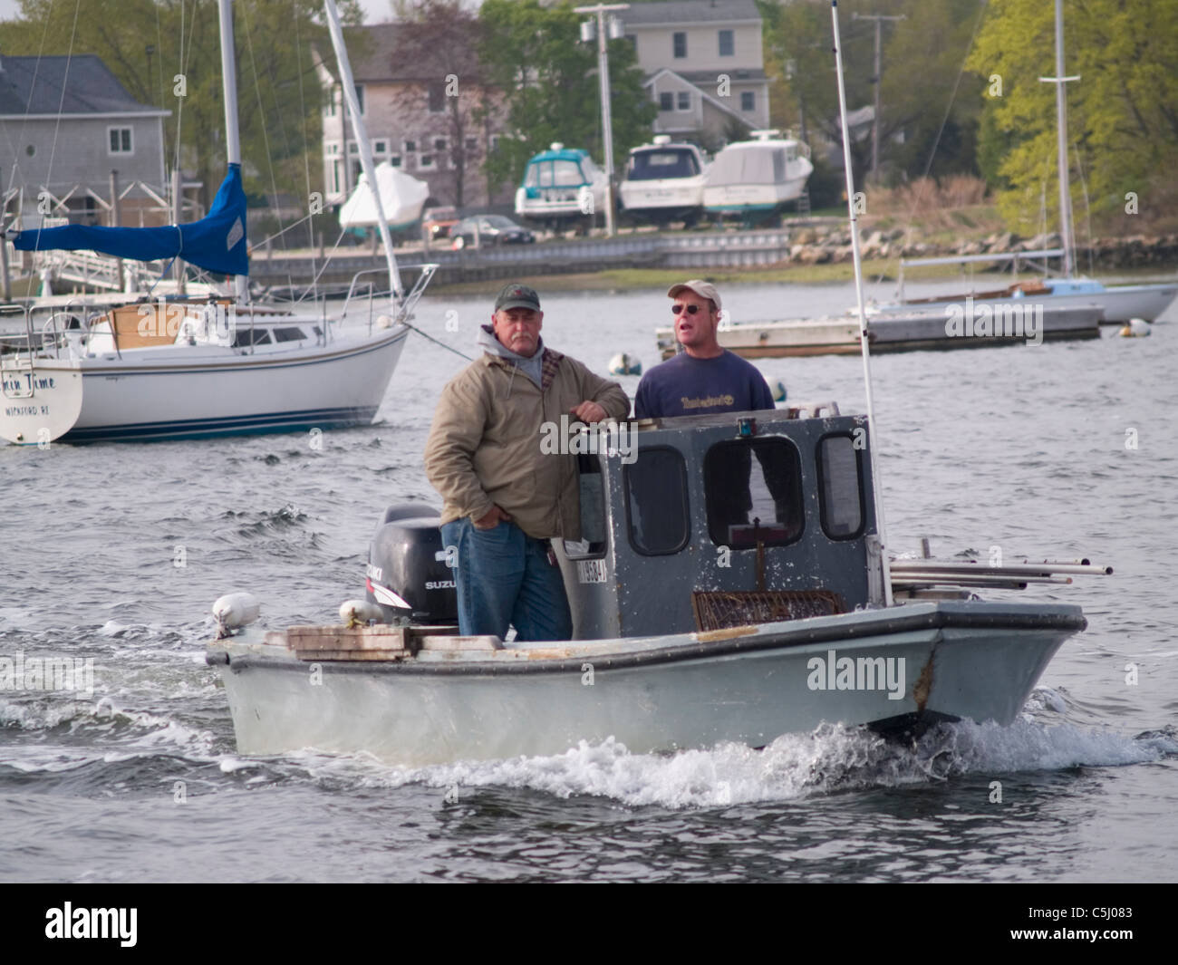 R.I. Quahoggers, at work in Wickford, Rhode Island. Stock Photo