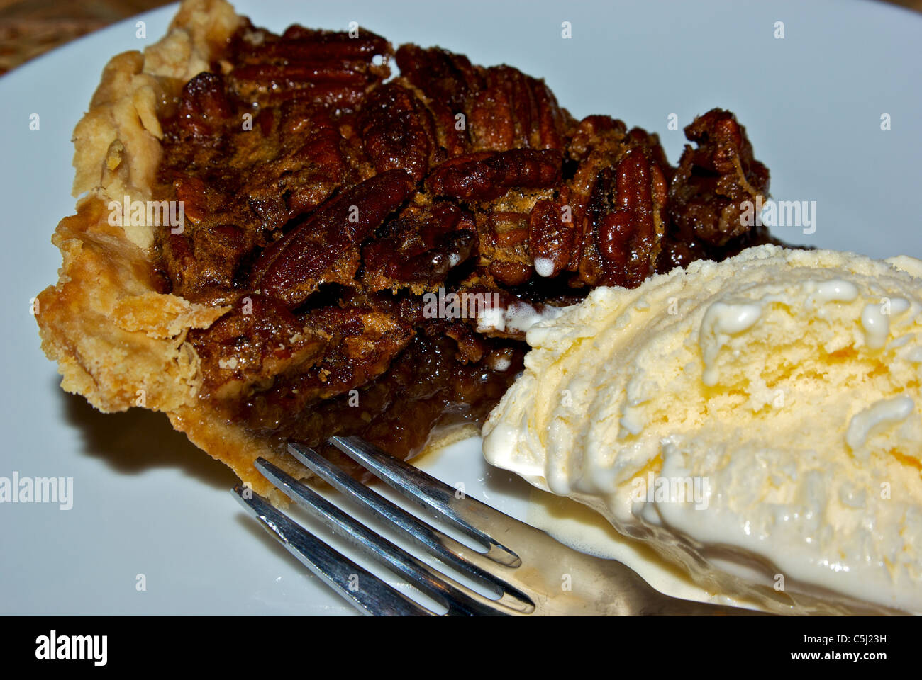 Wedge of pecan pie a la mode dessert Stock Photo Alamy