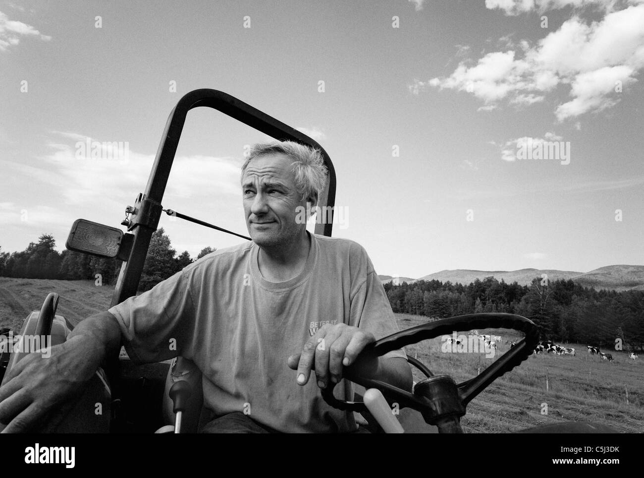 dairy farmer and film maker on his tractor in Waterbury Center, Vermont