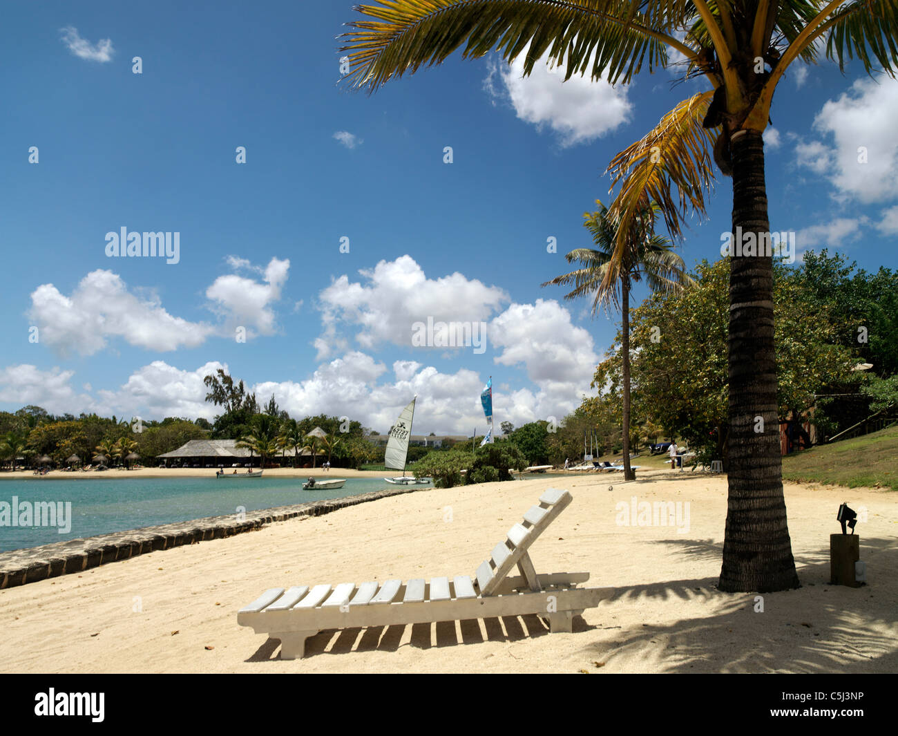 Balaclava Mauritius Sun Lounger On The Beach Under Palm Tree Stock
