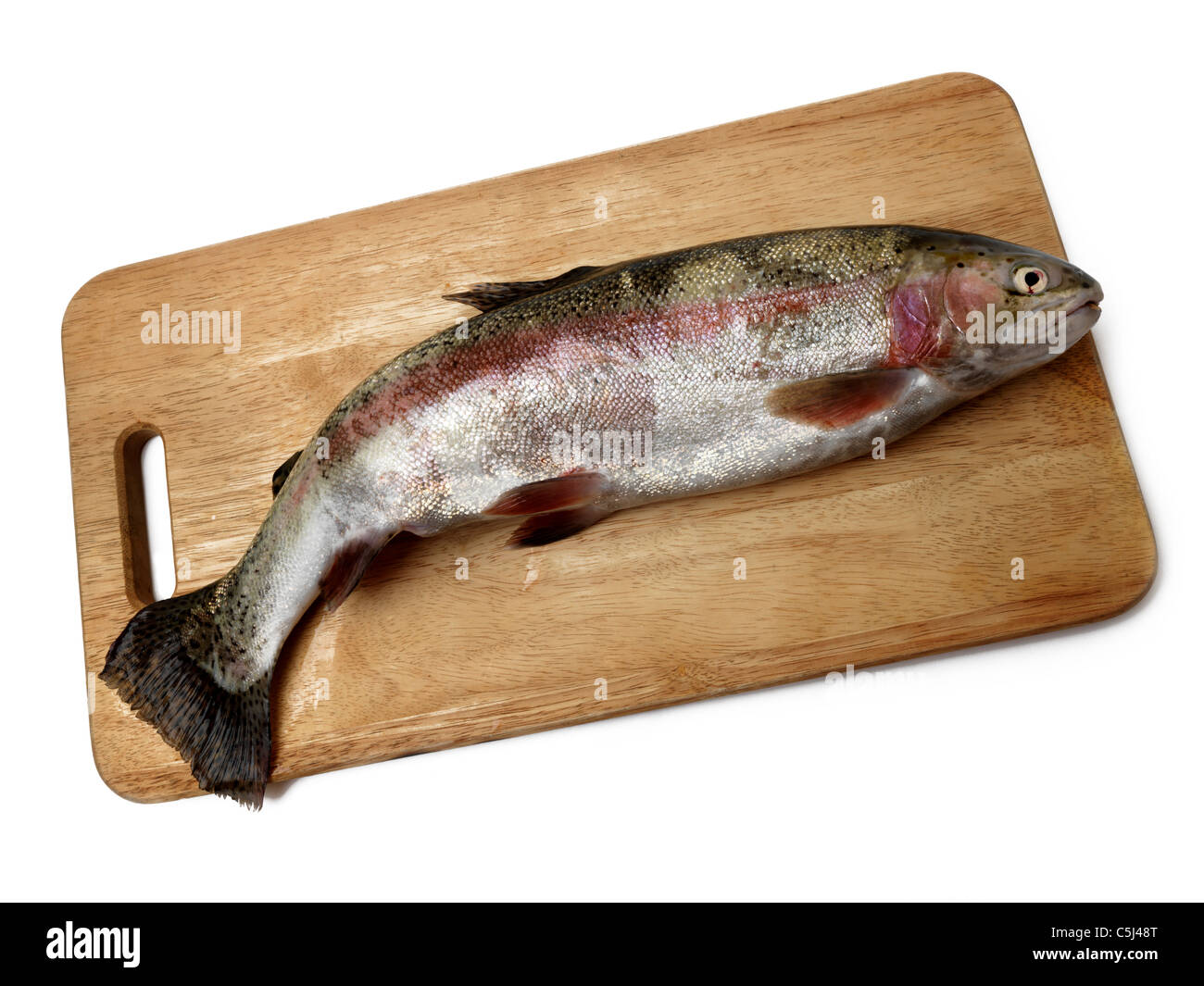 Colourful Trout On Wooden Chopping Board Stock Photo