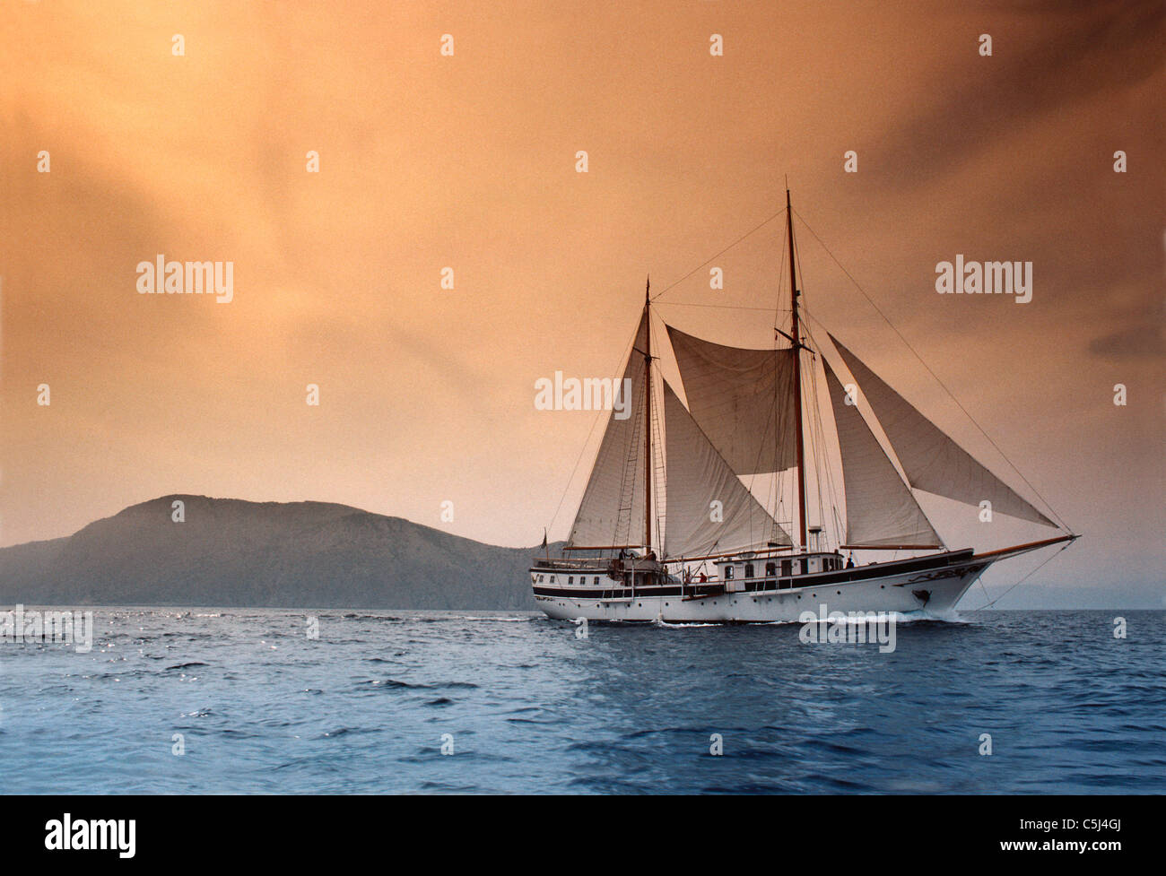 Traditional east Mediterranean sailing boat under full sail off Hydra