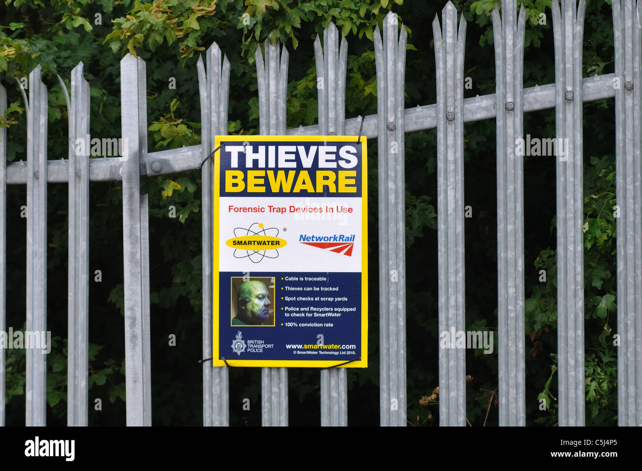 Thieves beware notice alongside railway line, UK Stock Photo