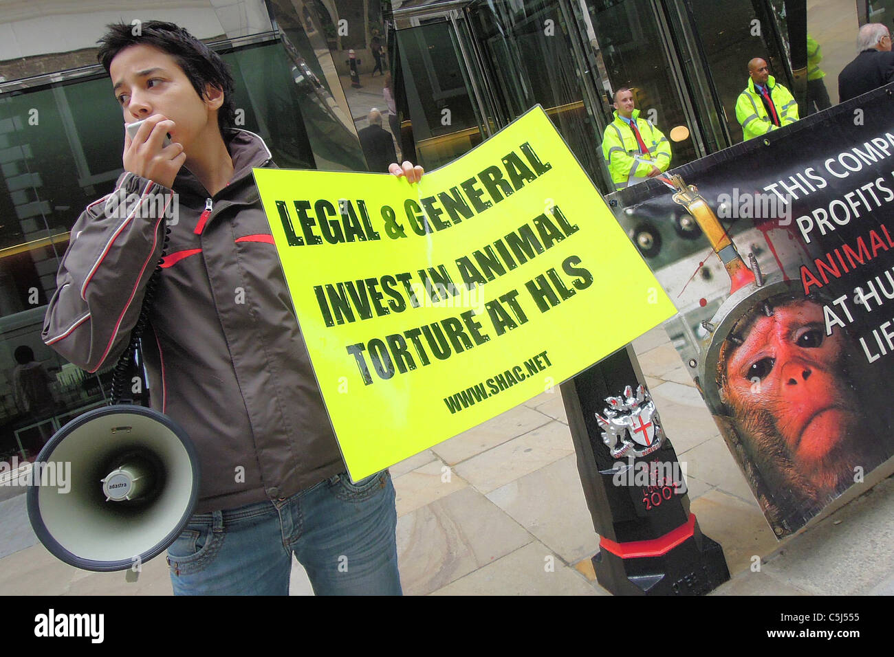 Animal rights activists protest outside Legal & Generals office on London Wall, in the City of London. Stock Photo