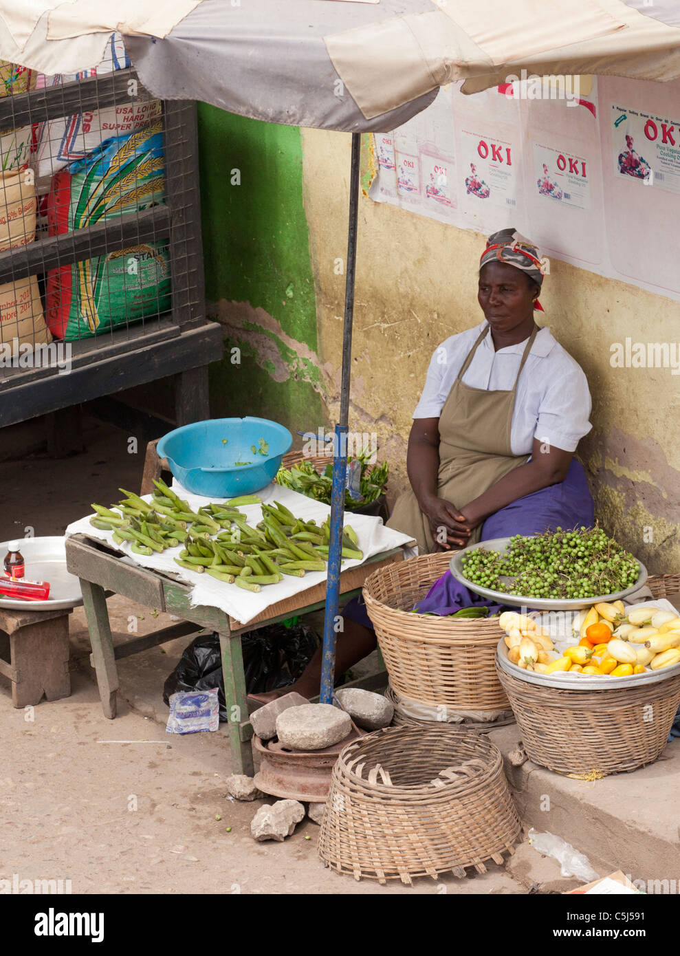 African Woman Selling Produce From Market Stall At Agbogbloshie Market