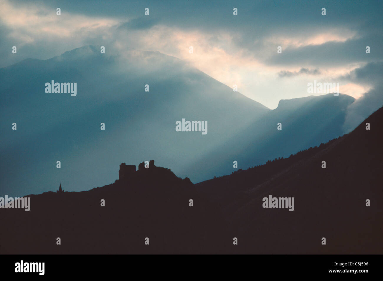 Silhouette of ruined castle or fortress under the hills of La Madonie, Sicily, Italy Stock Photo