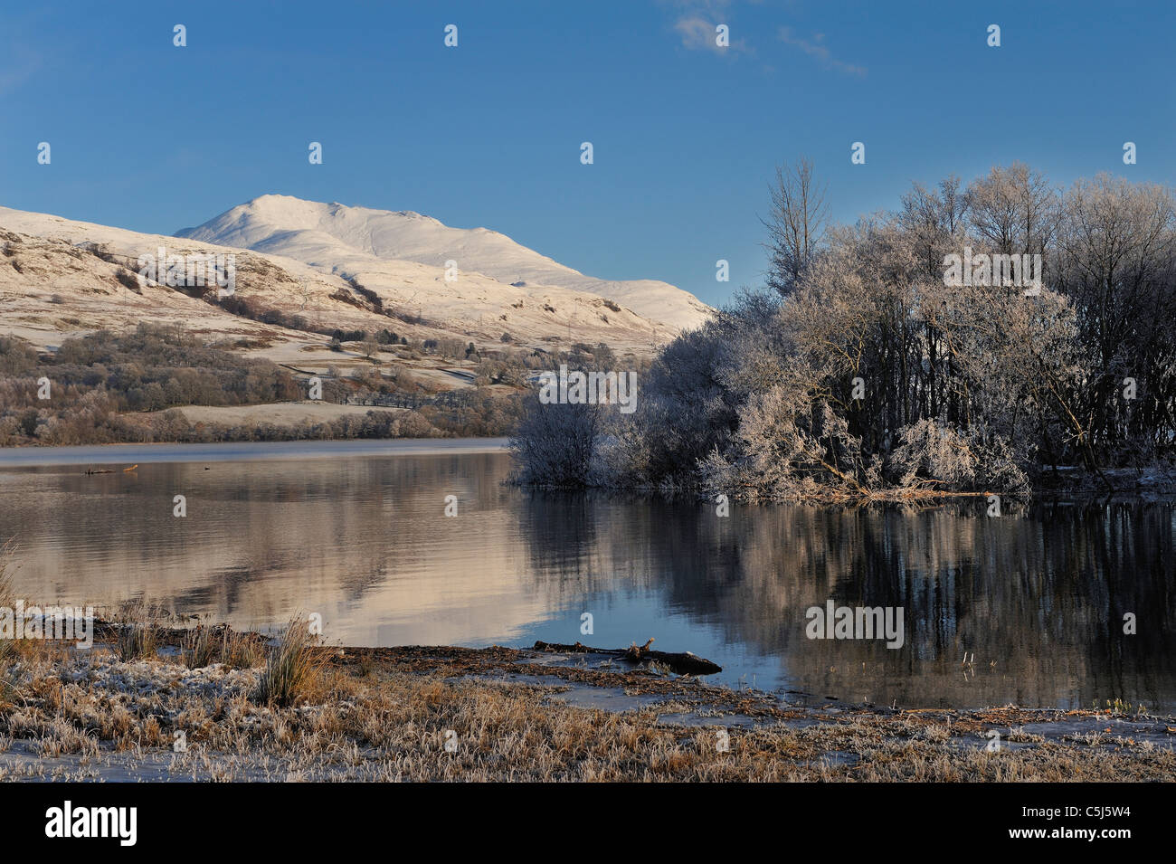 Snowcovered Ben Lawers seen beyond an island in Loch Tay near Killin