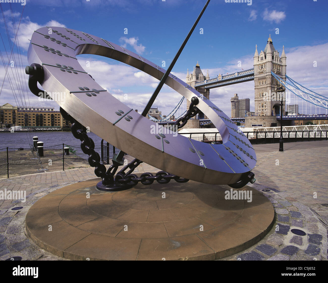 Sundial on the north bank of the River Thames, London; Tower Bridge behind. Stock Photo