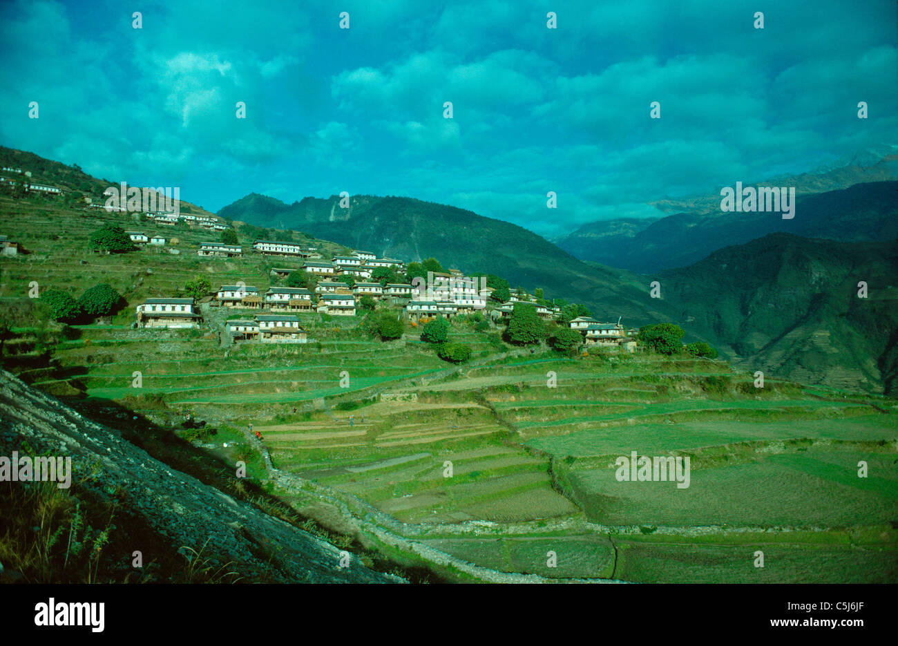 The Gurung village of Ghandrung on its ridge in the foothills of the Annapurnas, Nepal Himalaya. Stock Photo