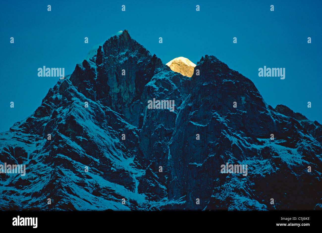 The highest summit of Numbur catches early sunlight, Solu region, Nepal Himalaya. Stock Photo
