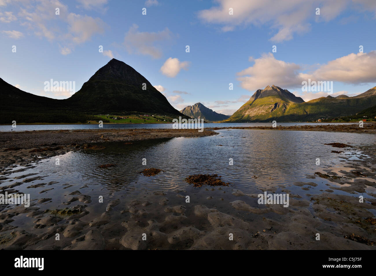 The island of Aldra with the Hjartinden peaks from the shore at Haugland, north-west Norway. Stock Photo