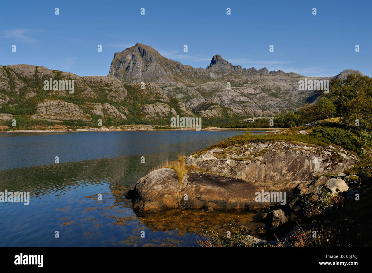 The peaks of Blokktinden from Stromsvik, north-west Norway. Stock Photo