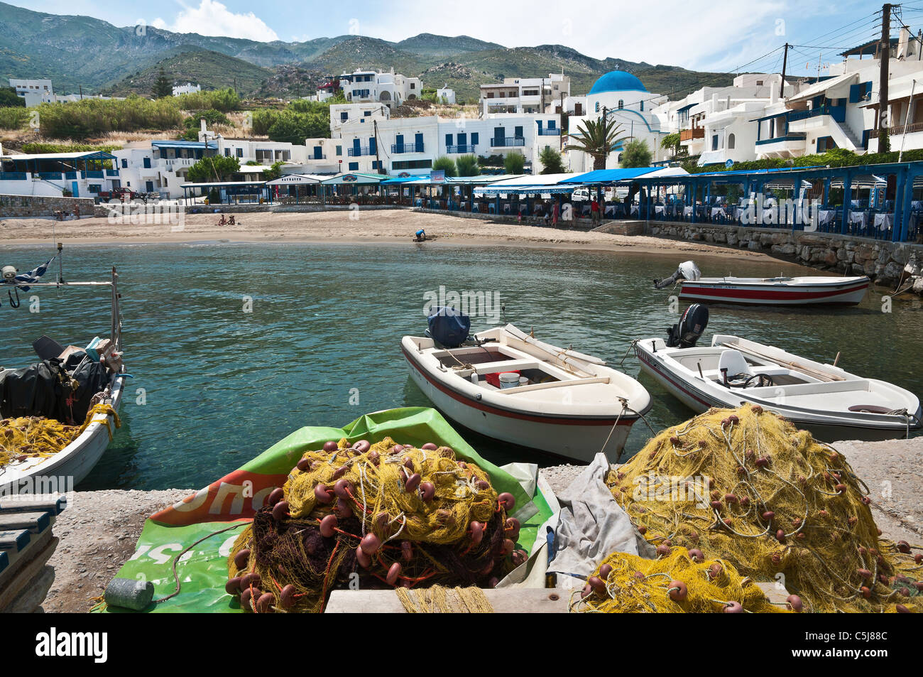 View across the harbour in the little fishing village of Apollon ...