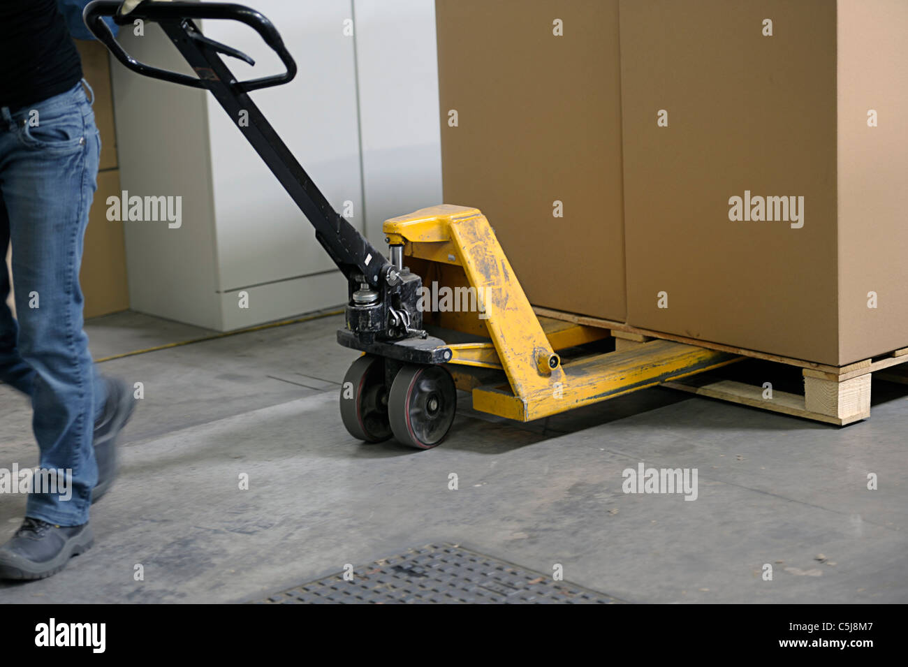 pallet truck with carton boxes Stock Photo