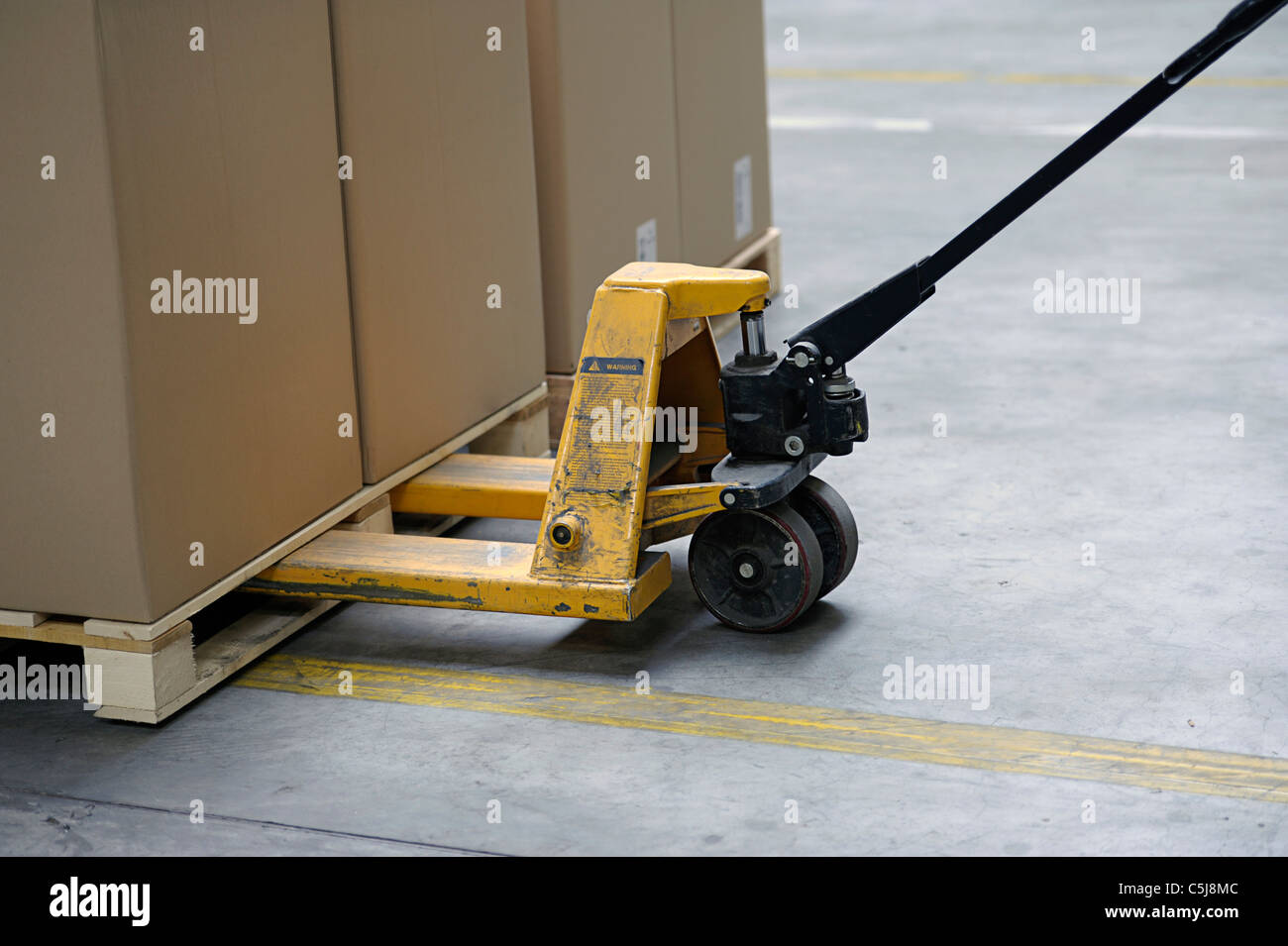 pallet truck with carton boxes Stock Photo