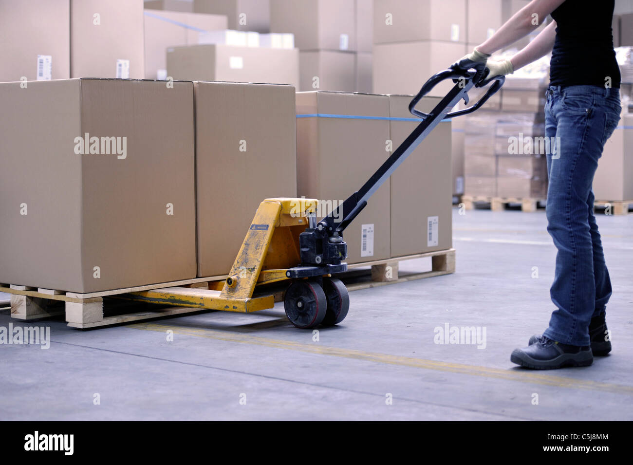 carton boxes being lifted with forklift Stock Photo