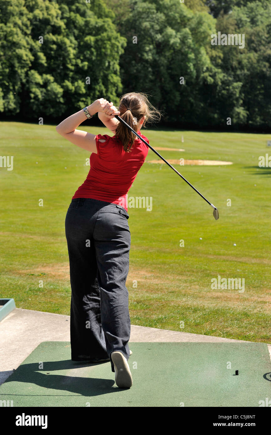 back view of female golfer Stock Photo