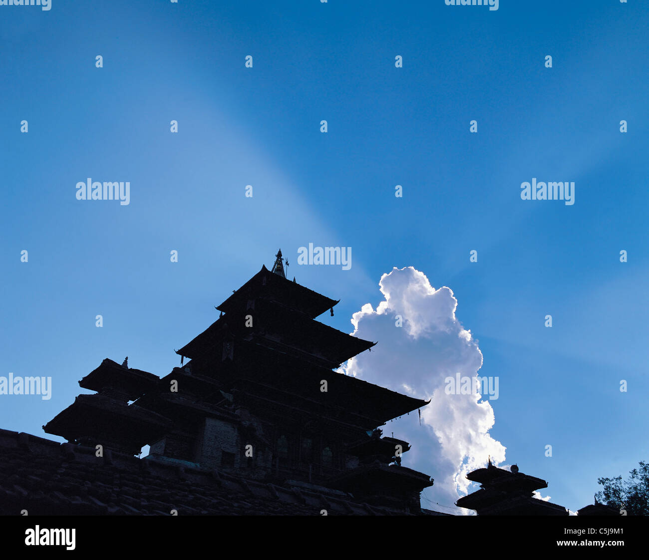 Temple pagodas in Durbar Square outlined against clouds and blue sky in Kathmandu, Nepal Stock Photo