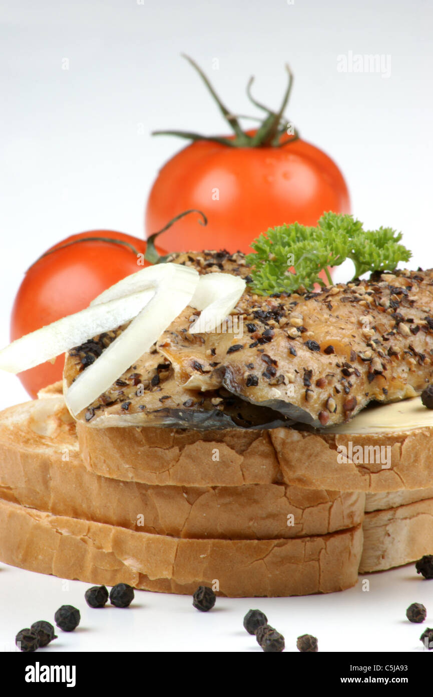 smoked mackerel fillet on toast with pepper and tomato Stock Photo Alamy