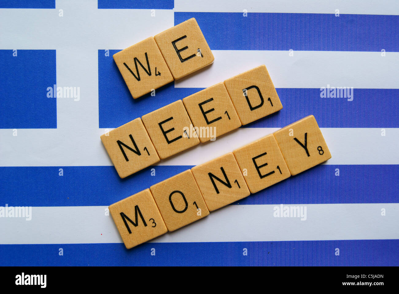 We need money spelled on a flag of Greece Stock Photo
