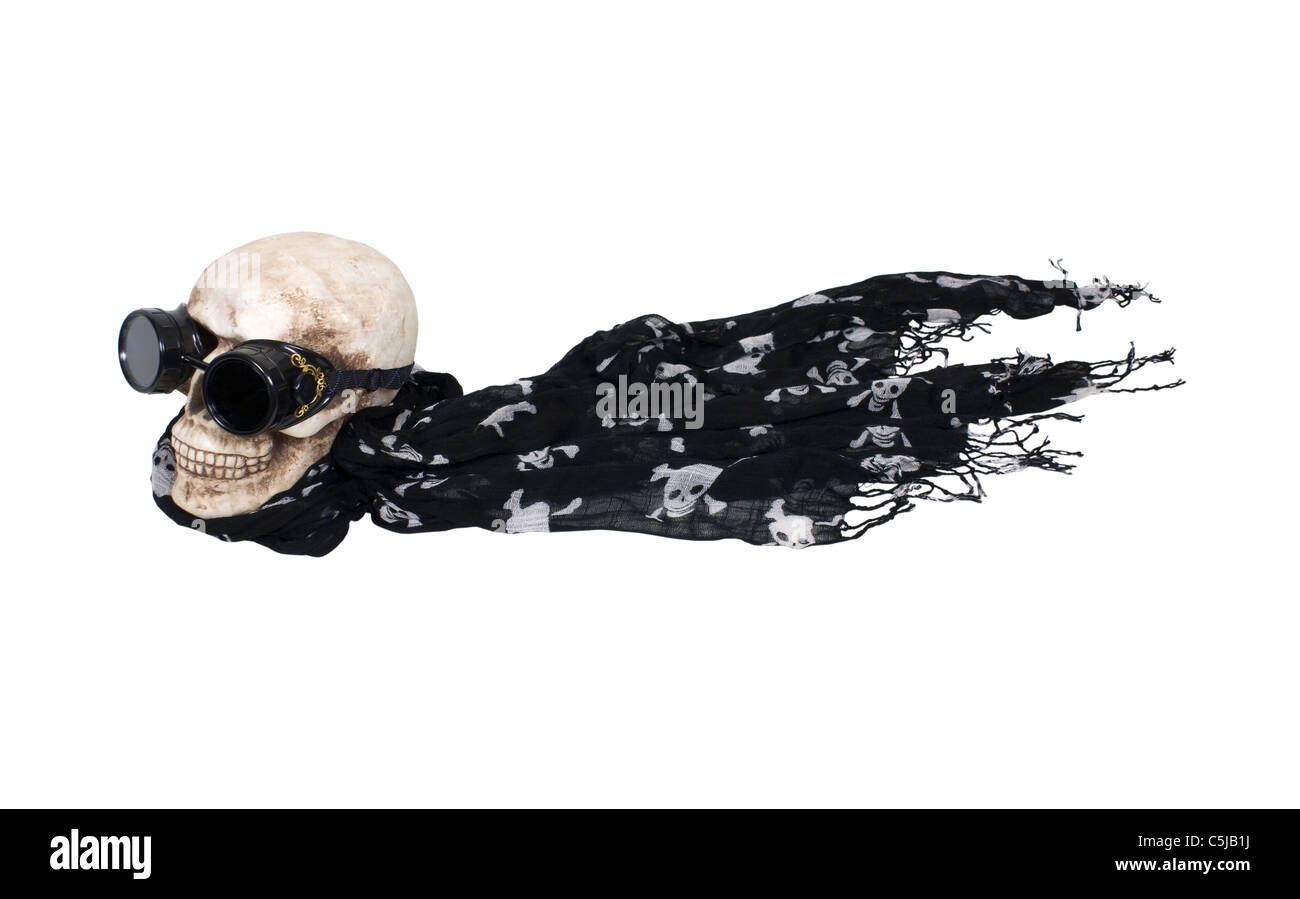Flying steampunk black goggles used for eye protection and fashion statement on a skull with a scarf - path included Stock Photo