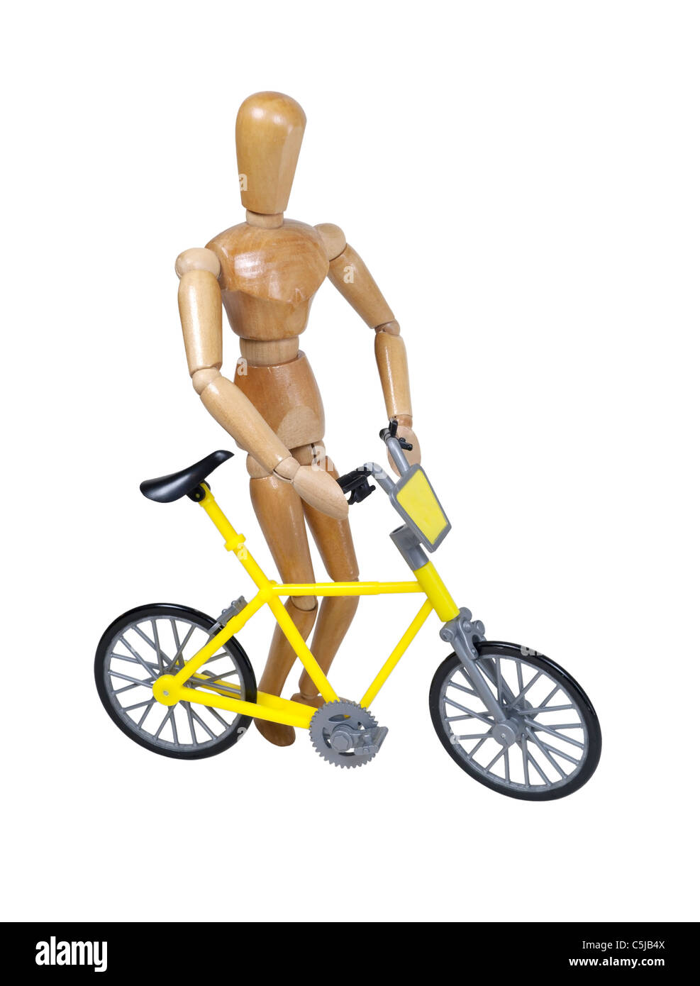 Walking a yellow bicycle used as a personal transportation device - path included Stock Photo