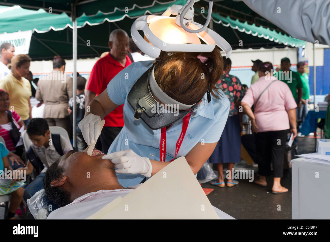 Dentist examining a patient during a Government sponsored fair. Panama City, Republic of Panama, Central America Stock Photo