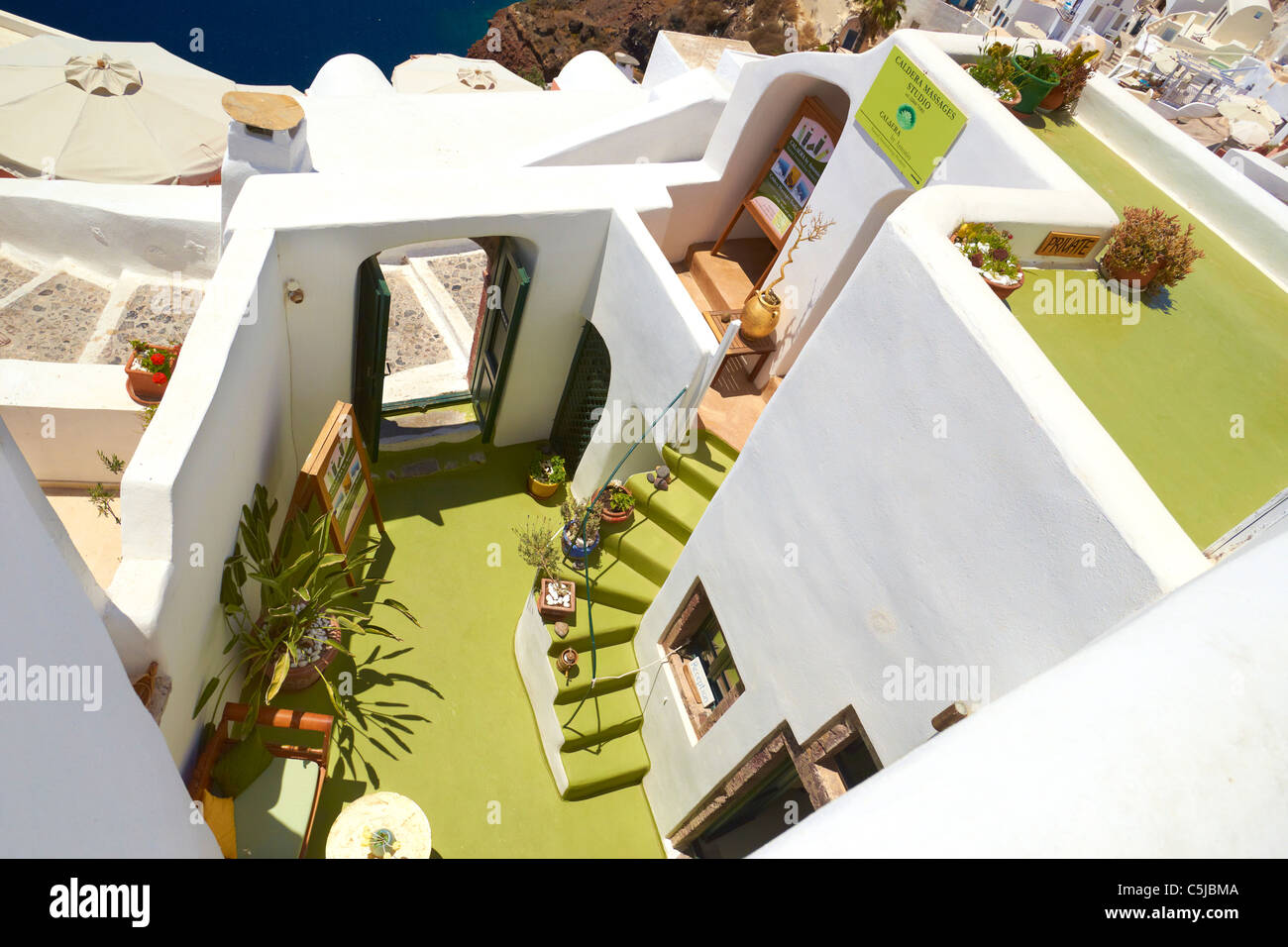 White walls houses - popular view in Oia Town, Santorini Island, Cyclades, Greece Stock Photo