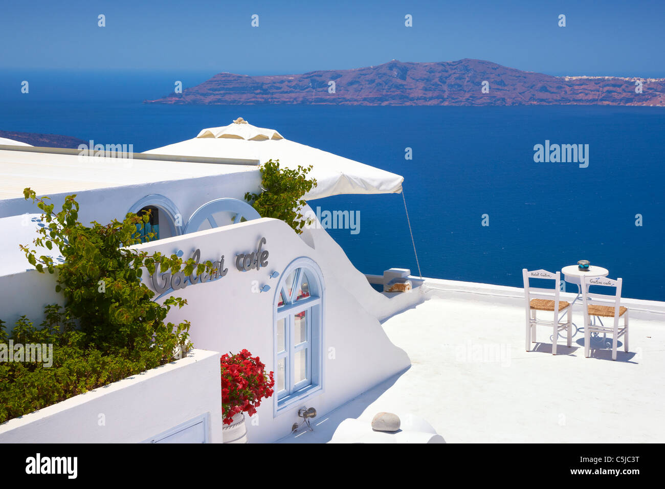 Thira - landscape with cafe terrace and view at sea, Santorini Island, Cyclades Islands, Greece Stock Photo