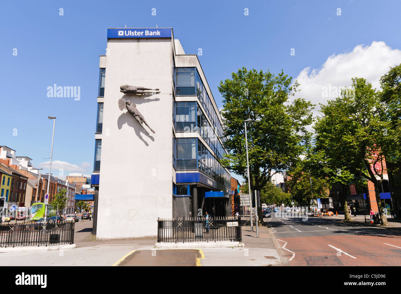 The famous Ulster Bank Building at Shaftesbury Square, Belfast with "Flying Figures" sculptures by Dame Elizabeth Frink,  See CMP2JH for winter shot Stock Photo
