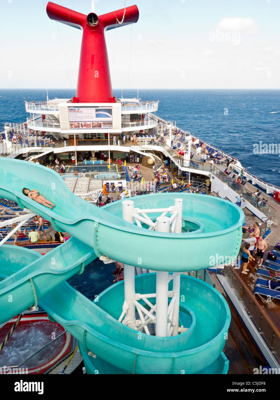 Young girl sliding on water slide on Carnival's Triumph cruise ship in the Gulf of Mexico Stock Photo