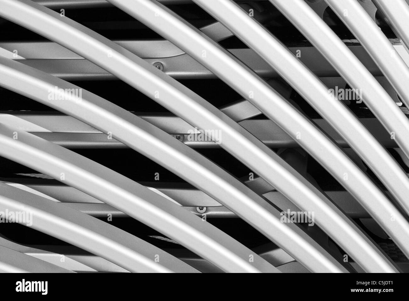Abstract shapes and patterns formed by stacking deck chairs Stock Photo