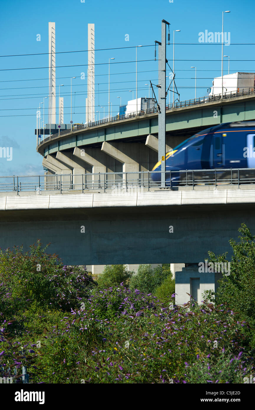 A train on the high speed rail link passes by the Dartford River Crossing in Thurrock,Essex, UK. Stock Photo