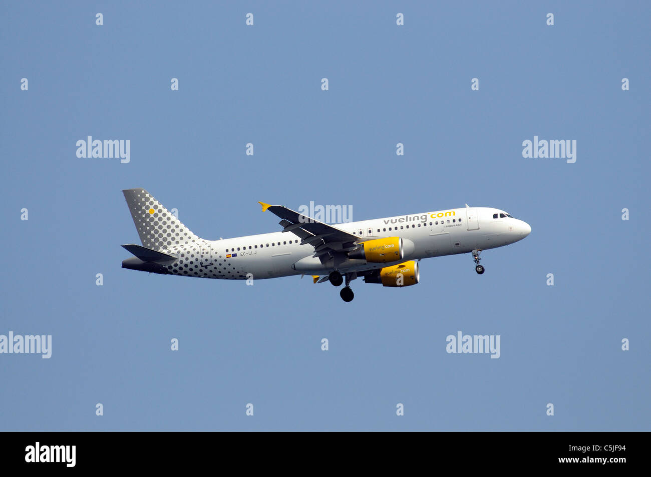 AIRBUS A 320 aircraft of Vueling airline company on final approach to land at Ibiza Airport. EC-LLJ Stock Photo