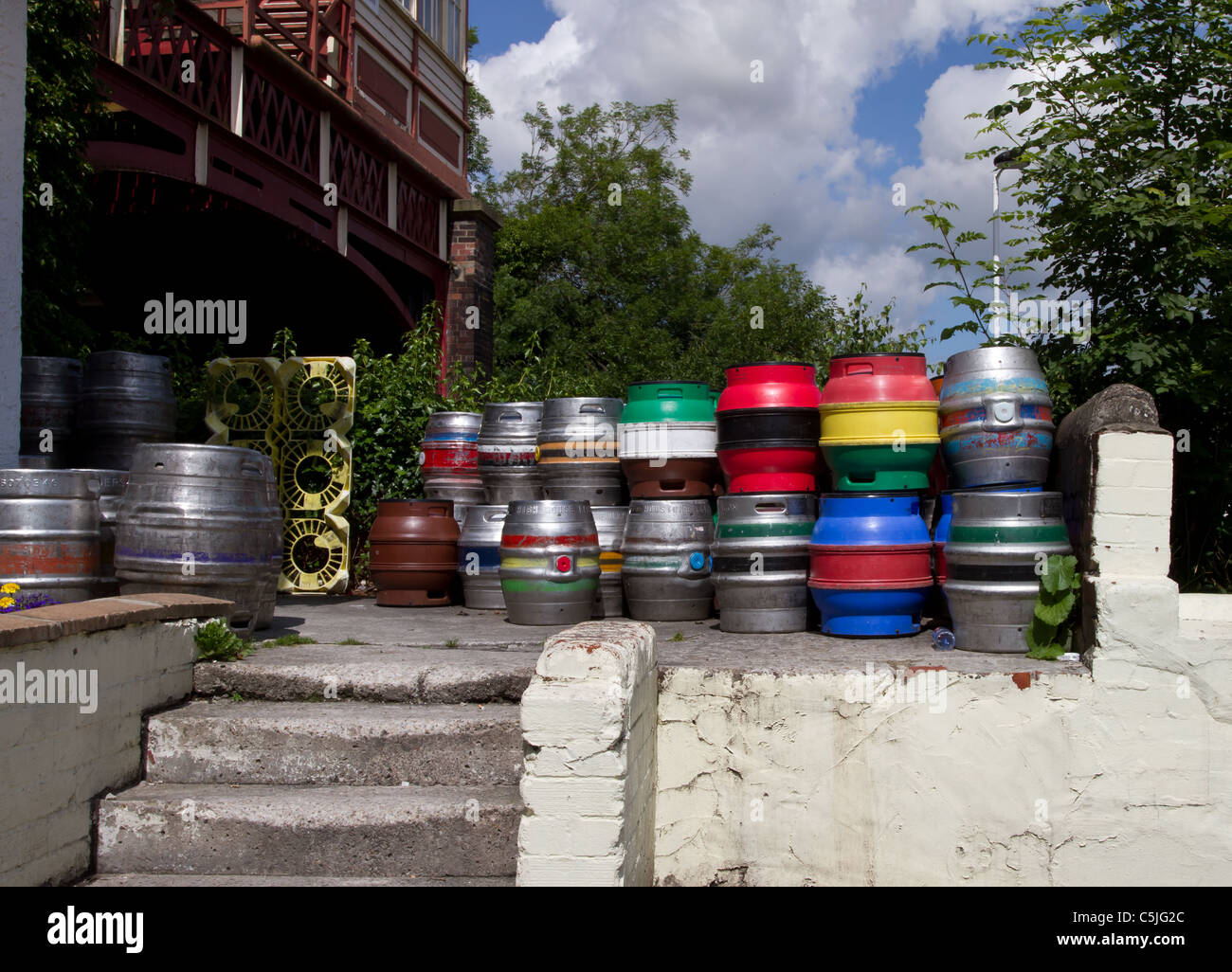 stack of vibrant multicoloured beer kegs. Stock Photo