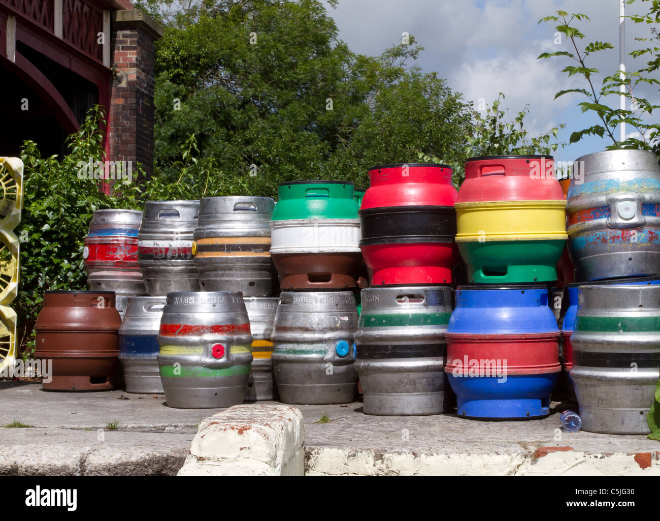 stack of vibrant multicoloured beer kegs. Stock Photo
