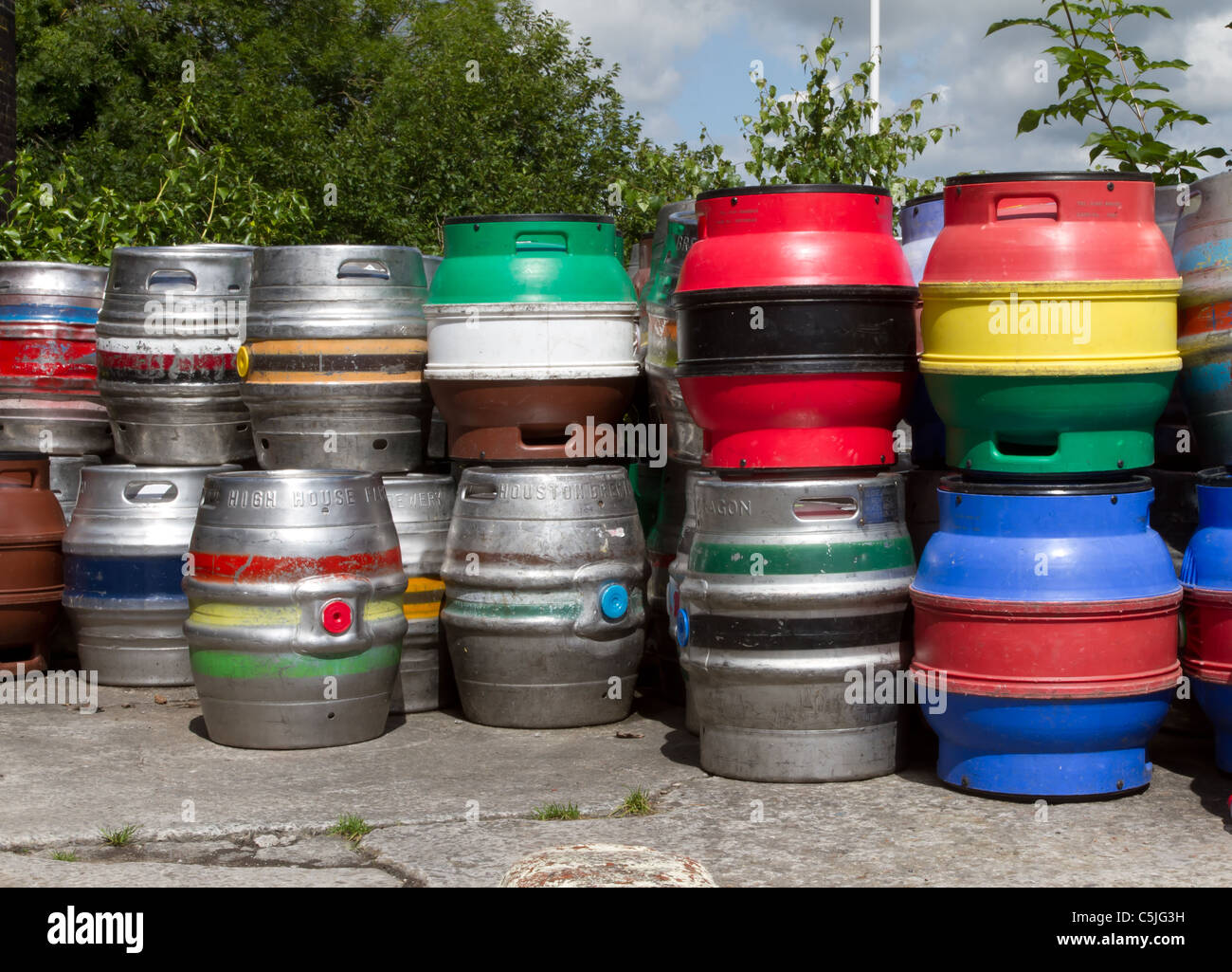 stack of vibrant multicoloured beer kegs. Stock Photo