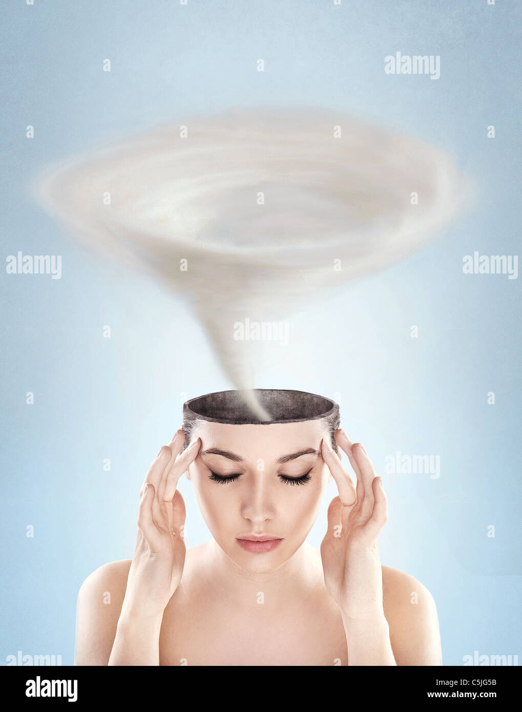 Conceptual picture - tornado in woman's head Stock Photo