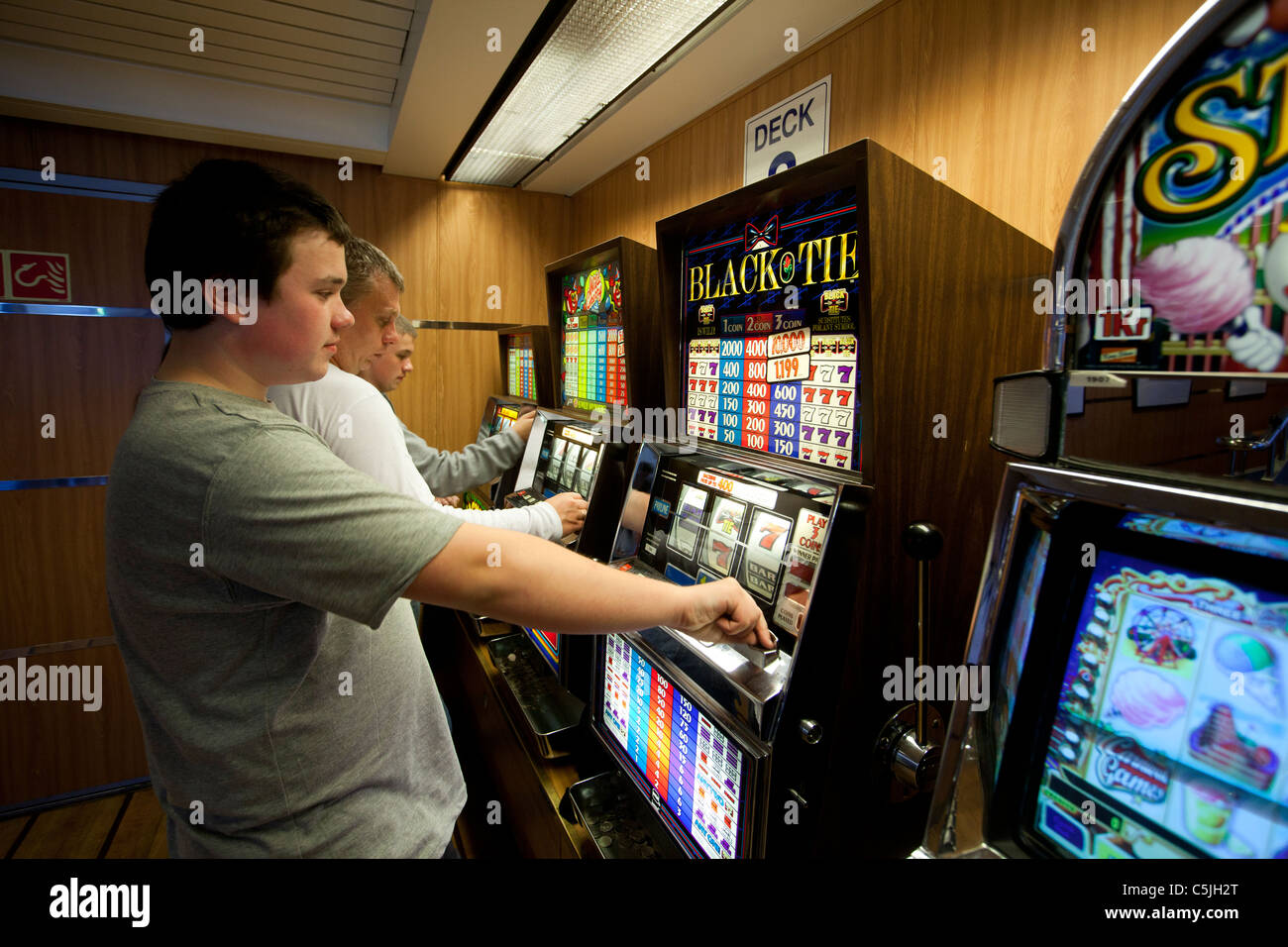 People play on slot machines Stock Photo