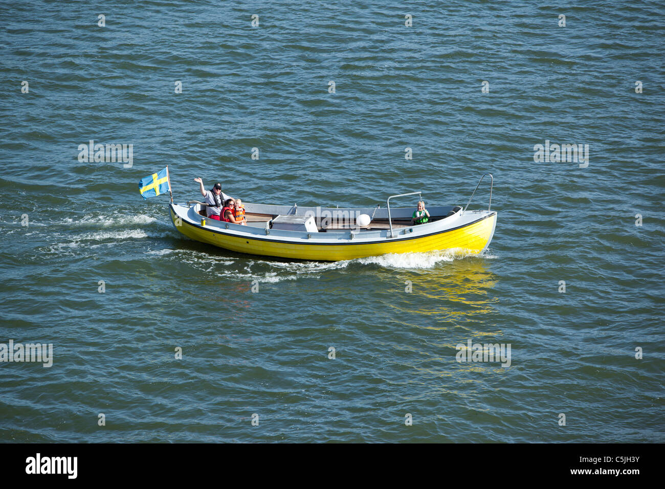 Family out there with his boat Stock Photo