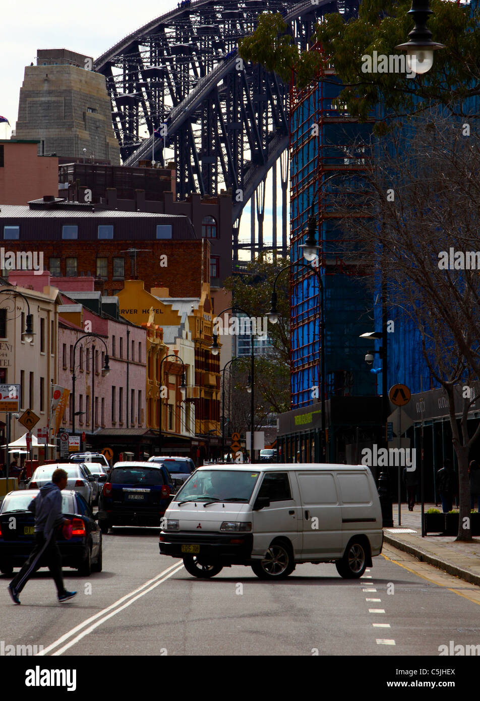 Sydney Harbour Bridge looming over George Street in Central Sydney Australia Stock Photo