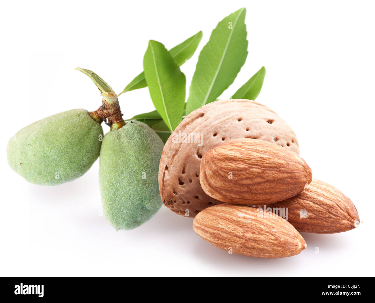 Group of almond nuts with leaves. Isolated on a white background. Stock Photo