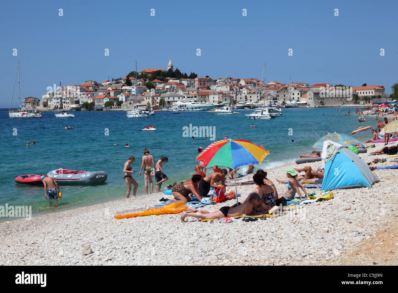 Pebble beach at the Croatian town Primosten Stock Photo